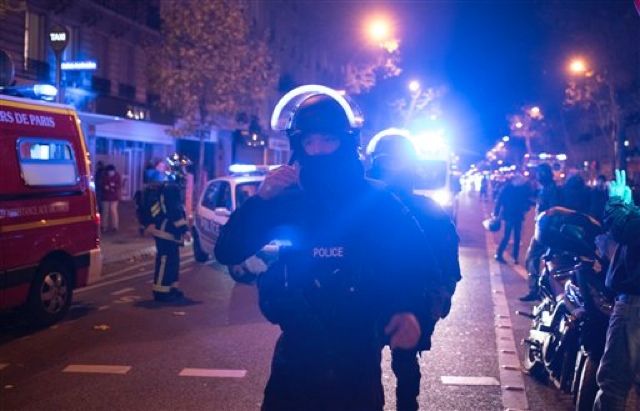 Elite police officers arrive outside the Bataclan theater in Paris, France